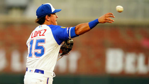 Aug 19, 2023; Cumberland, Georgia, USA; Atlanta Braves second baseman Nicky Lopez (15) throw to first for an out against the San Francisco Giants during the third inning at Truist Park.